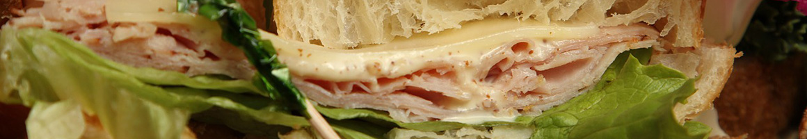 Eating Sandwich at Casapulla's Middletown Subs Steaks & Deli restaurant in Middletown, DE.